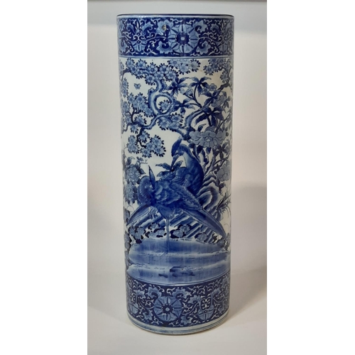 51 - A Chinese blue and white cylindrical stickstand decorated with pheasants, foliage and set within rep... 