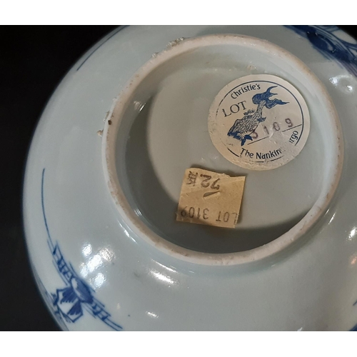 37 - A Chinese Nanking cargo blue and white porcelain footed bowl, decorated with village scenes, sticker... 