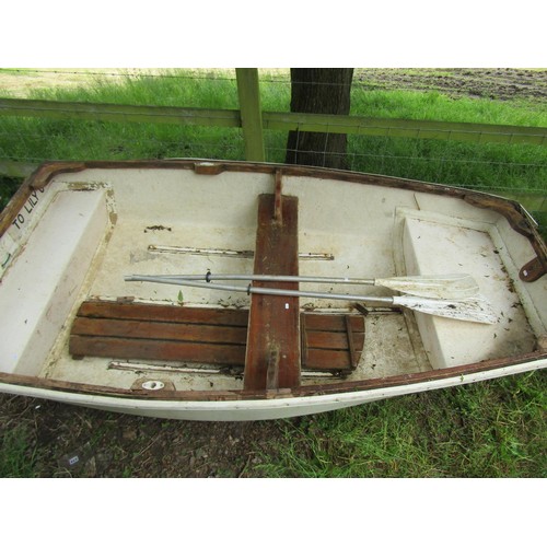 1111 - A small rowing boat with painted fibreglass hull, teak trim and seat, 232 cm x 130 cm approximately ... 