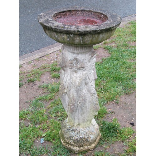 1121 - A weathered cast composition stone two sectional birdbath of circular form raised on a pedestal with... 