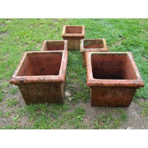 1124 - A pair of weathered square  terracotta planters with moulded rims, 30 cm high x 37 cm square, togeth... 