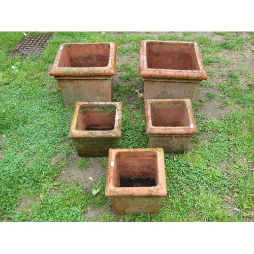 1124 - A pair of weathered square  terracotta planters with moulded rims, 30 cm high x 37 cm square, togeth... 