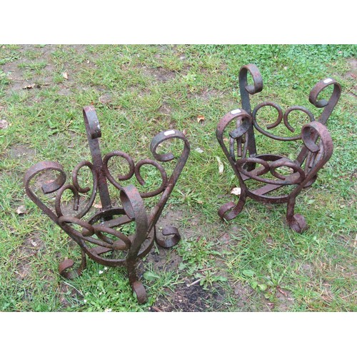 1125 - A pair of weathered heavy gauge iron  work crown shaped  pots stands with open scrollwork detail, 41... 