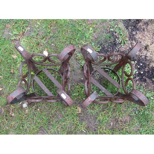 1125 - A pair of weathered heavy gauge iron  work crown shaped  pots stands with open scrollwork detail, 41... 