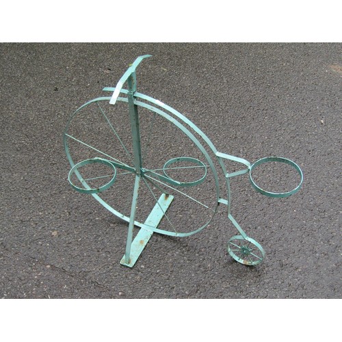 1127 - A painted novelty light steel garden flower pot stand in the form of a penny farthing or ordinary cy... 