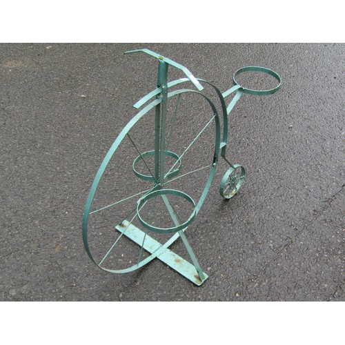 1127 - A painted novelty light steel garden flower pot stand in the form of a penny farthing or ordinary cy... 