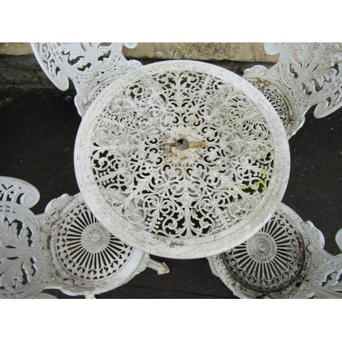 1129 - A cream painted cast aluminium garden terrace table of ciruclar form with decorative pierced top tog... 