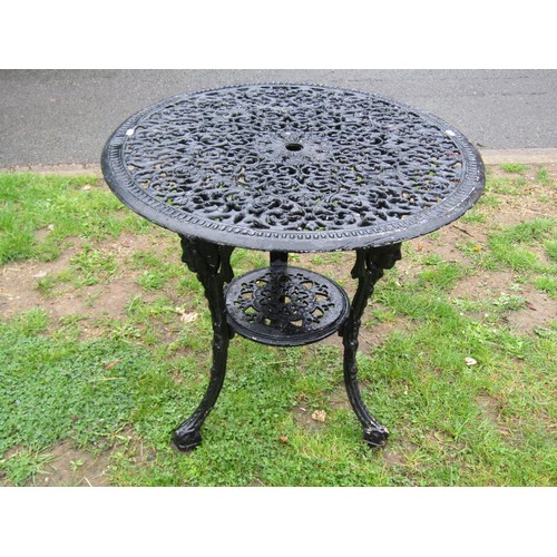 1134 - A cast iron Britannia head pub/garden table with associated fixed circular overhanging decorative pi... 