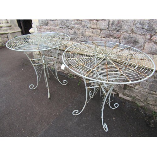 1135 - A pair of weathered good quality contemporary heavy gauge  wirework bistro tables with radiating cir... 