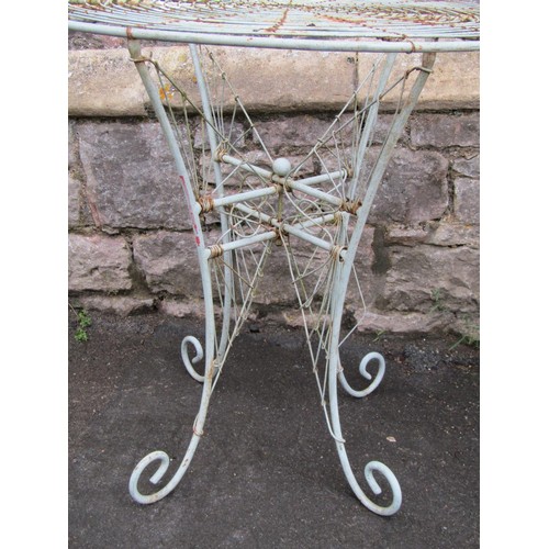 1135 - A pair of weathered good quality contemporary heavy gauge  wirework bistro tables with radiating cir... 