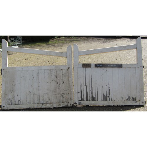 1095 - A pair of painted wooden entrance gates with sloping chamfered rails and through jointed constructio... 