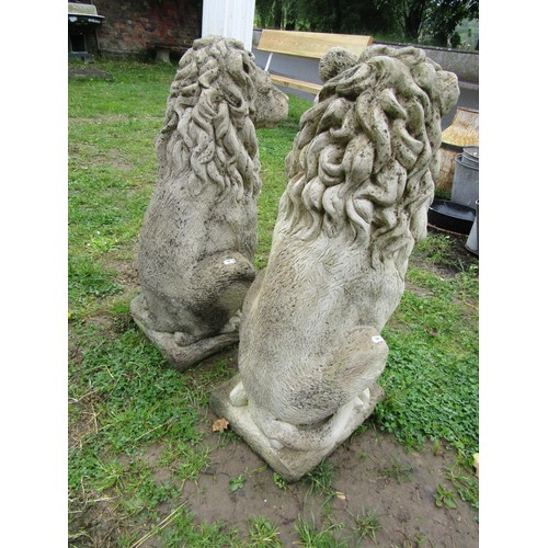 1143 - A pair of weathered cast composition stone garden terrace/pier ornaments in the form of seated lions... 