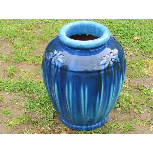 1147 - A good quality heavy contemporary blue glazed oviform jar with moulded flower head and fluted detail... 