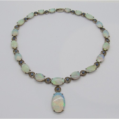 398 - Fine early 20th century opal and sapphire demi-parure comprising a graduated opal pendant necklace a... 