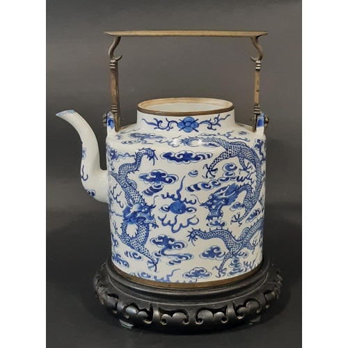 36 - A large Chinese blue and white export porcelain tea pot (lacking cover), with applied brass work han... 