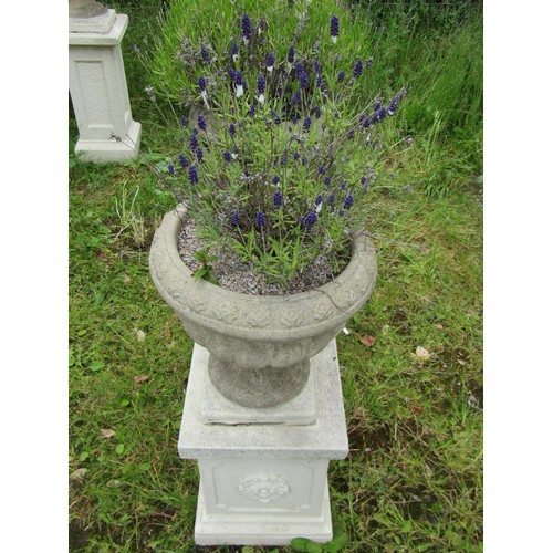 1032 - A pair of weathered cast composition stone garden urns, the circular lobed bowls set on painted squa... 