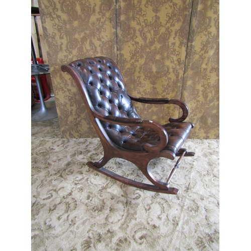 1311 - A Regency style mahogany rocking / library chair, with studded leatherette finish, together with an ... 