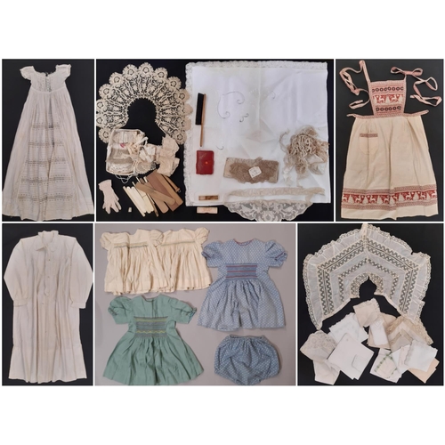 801 - A mixed textile lot comprising an early 20th century cotton nightgown, a long lace trimmed baby gown... 