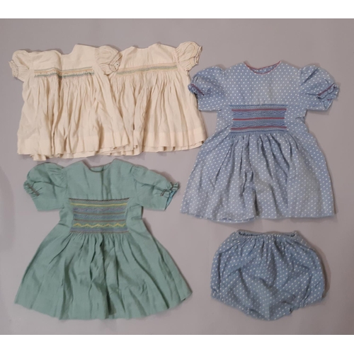 801 - A mixed textile lot comprising an early 20th century cotton nightgown, a long lace trimmed baby gown... 