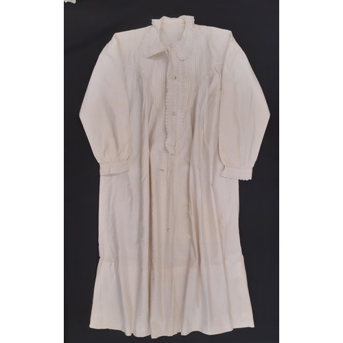 801 - A mixed textile lot comprising an early 20th century cotton nightgown, a long lace trimmed baby gown... 