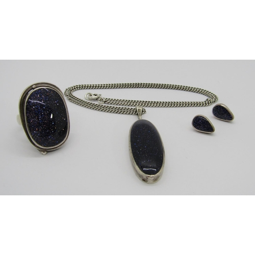 412 - Group of silver jewellery set with blue goldstone comprising a dress ring and pendant both by 'OSW',... 