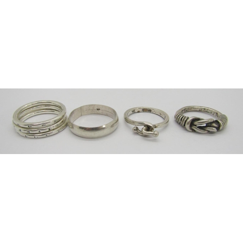 419 - Collection of silver and white metal rings of various design to include a Celtic style band, a puzzl... 