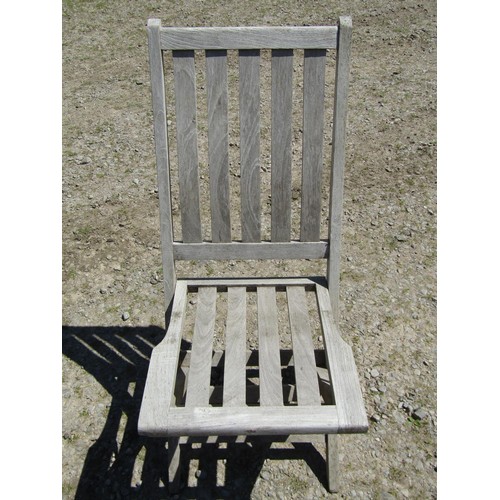 1094 - Six weathered teak folding garden chairs with slatted seats and backs (set of five plus one similar)... 