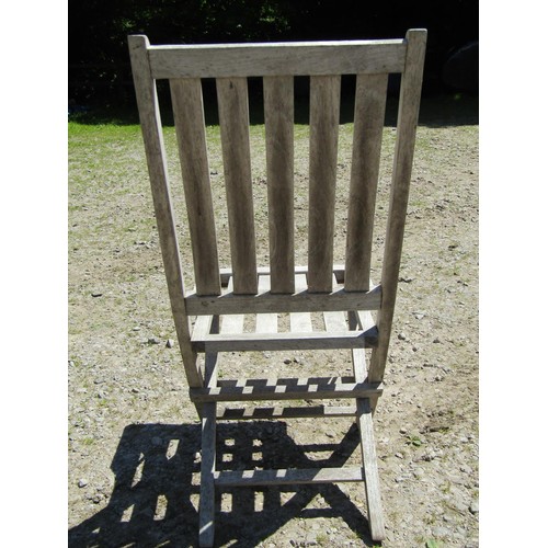 1094 - Six weathered teak folding garden chairs with slatted seats and backs (set of five plus one similar)... 