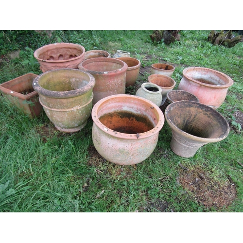 1079 - Fourteen weathered terracotta planters of varying size and design (some af)