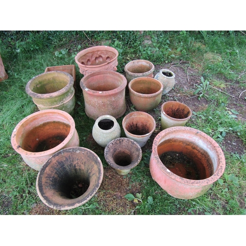 1079 - Fourteen weathered terracotta planters of varying size and design (some af)