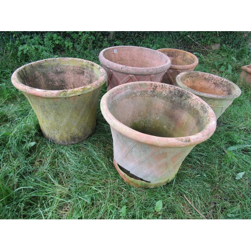 1080 - Four similar weathered terracotta garden planters in the form of lattice baskets, the largest exampl... 