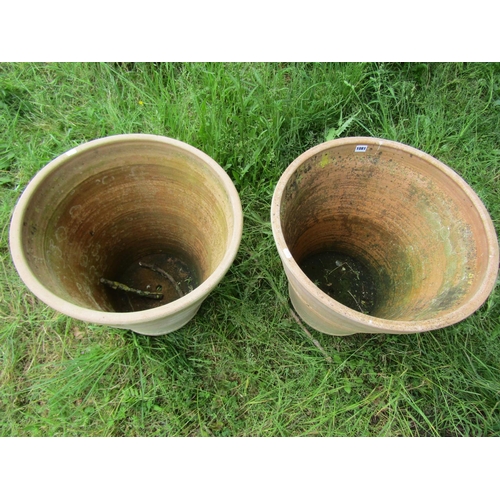 1081 - Two similar weathered terracotta planters of circular tapered and simply ribbed form approx 50 cm hi... 