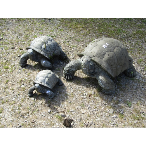 1108 - A weathered novelty composite (moulded fibreglass or plastic) family group of three tortoise garden ... 