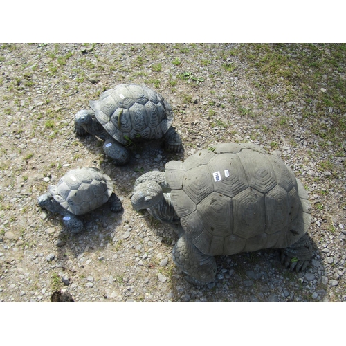 1108 - A weathered novelty composite (moulded fibreglass or plastic) family group of three tortoise garden ... 