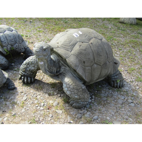 1108 - A weathered novelty composite (moulded fibreglass or plastic) family group of three tortoise garden ... 