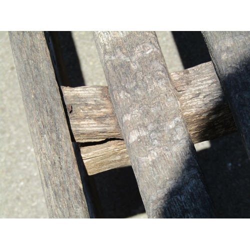 1141 - An unusually large (country house size) weathered oak Lutyens style garden bench (af), labelled to s... 