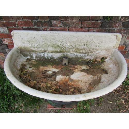 1163 - A large weathered painted cast iron and enamel water feature/basin of demi-lune form raised on a tap... 