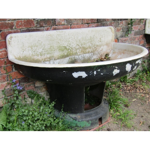 1163 - A large weathered painted cast iron and enamel water feature/basin of demi-lune form raised on a tap... 