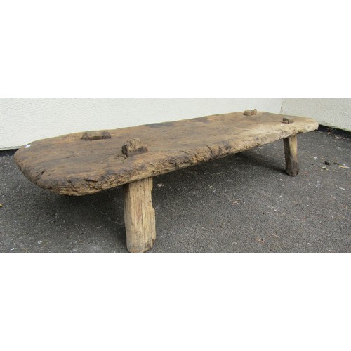 1674 - An antique dry rustic elm pig bench with through jointed tapered supports 30 cm high x 148 cm x 42 c... 