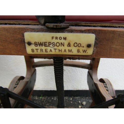 1676 - An Edwardian walnut child's high chair on swept and moulded supports united by turned stretchers tog... 