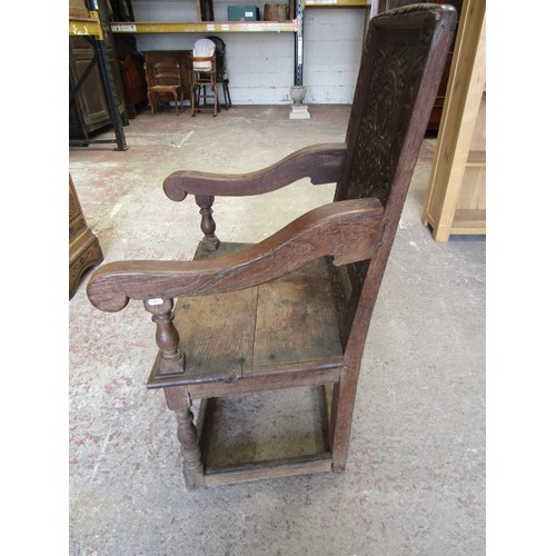 1680 - An Old English oak Wainscote type chair with rectangular carved and moulded panelled back over downs... 