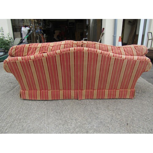 1685 - A vintage traditional sofa with swept and rolled arms, alternating pink and cream striped upholstery... 