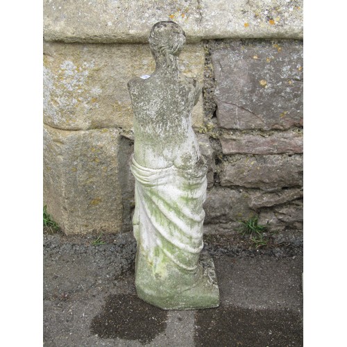 1149 - A small weathered cast composition stone Venus de Milo statue 57 cm high raised on an associated squ... 