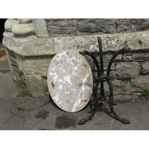 1151 - A Victorian gothic cast iron table base with acanthus detail on swept tripod supports beneath a late... 