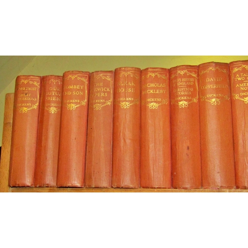 672 - An early 20th century red cloth bound collection of Charles Dickens novels (16) published by Odhams ... 