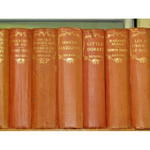 672 - An early 20th century red cloth bound collection of Charles Dickens novels (16) published by Odhams ... 