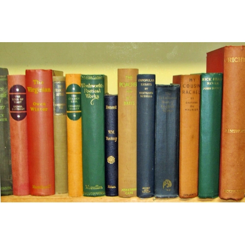 694 - A large library of literature hard backs including examples by Galsworthy, Moorehead, Shute, Rider H... 