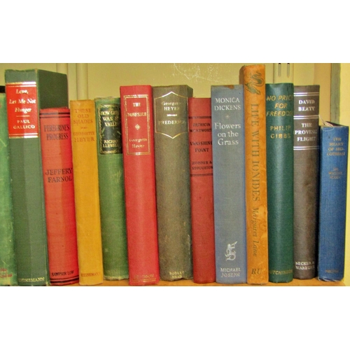 694 - A large library of literature hard backs including examples by Galsworthy, Moorehead, Shute, Rider H... 