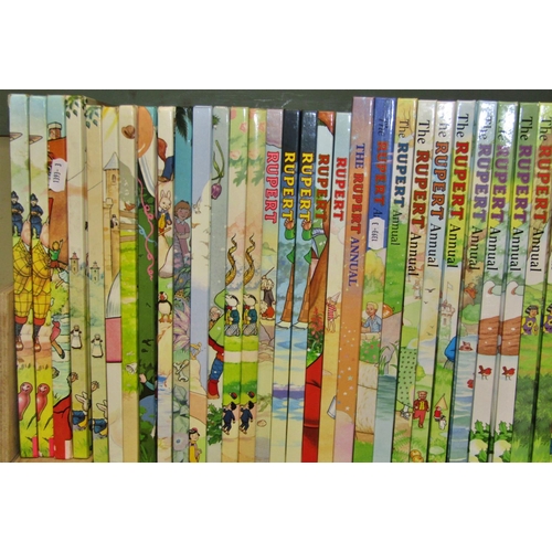 703 - Forty editions of Rupert the Bear Annuals (1980-2009 plus 2013/14/17) (some duplicates)