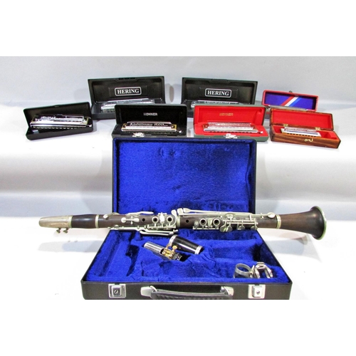 562 - A collection of seven harmonicas, including two Stan Harper Hering Chromatic 56’s, a Hering 5148, a ... 